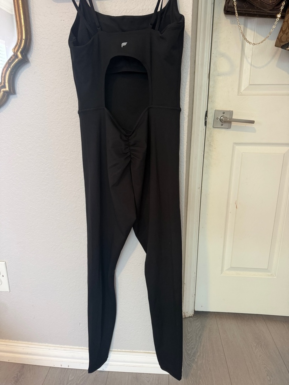 Fabletics-Black Cutout Jumpsuit with Ruched Back built in bra